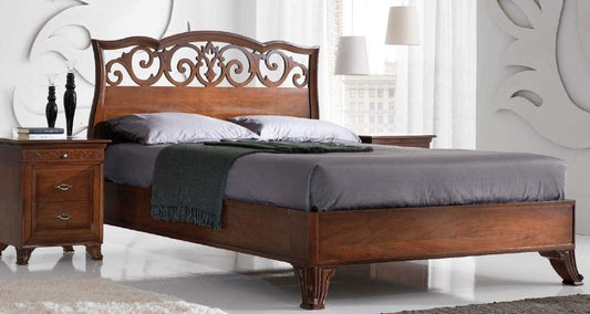 Dafne Italian Design Letto matrimoniale traforato legno scuro, H.136 X P.220 X L.90 - rete 180X200Testiera e pediera in legno massiccio di noce scuro.